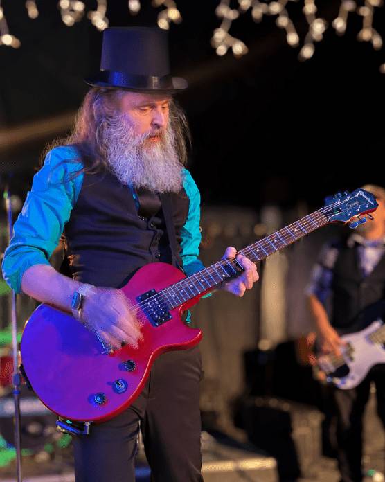 Bradley of CAKEMIX playing a red Les Paul Special May 8, 2026