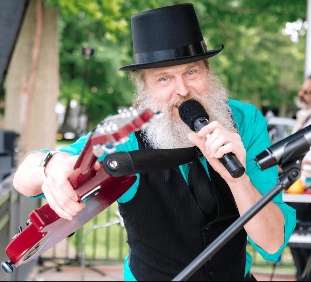 Bradley of CAKEMIX pointing with hisred Les Paul Special May 21, 2026